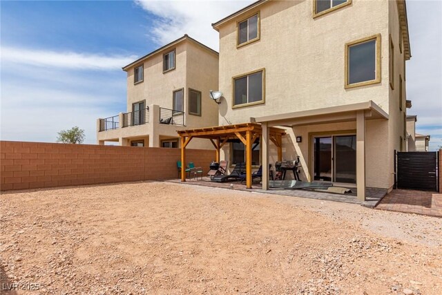 rear view of house with a patio