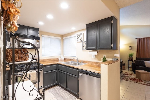 kitchen featuring light tile patterned flooring, stainless steel appliances, and sink