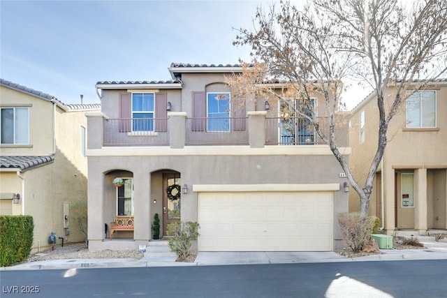 view of front of home with cooling unit, a balcony, and a garage