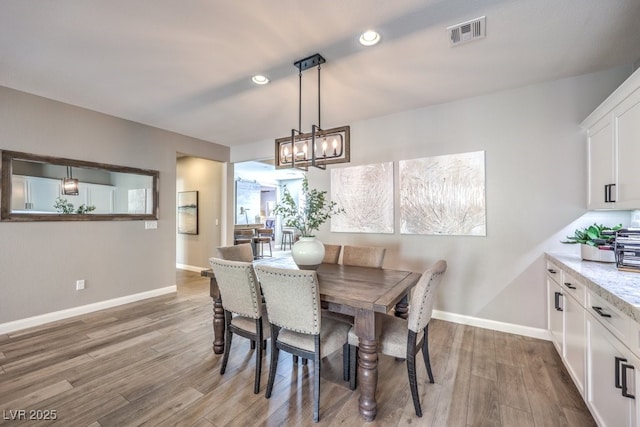 dining area featuring hardwood / wood-style flooring