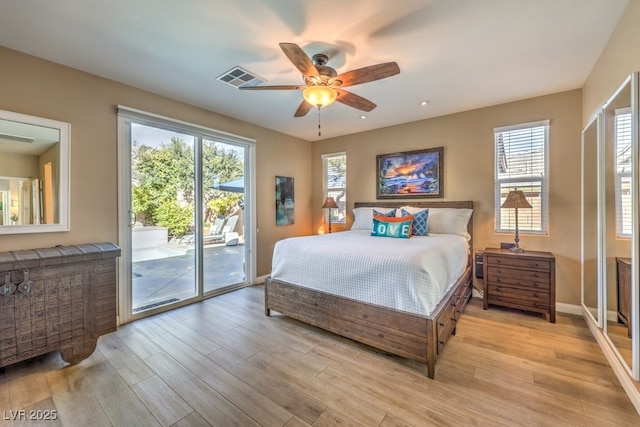 bedroom featuring multiple windows, access to outside, ceiling fan, and light hardwood / wood-style floors