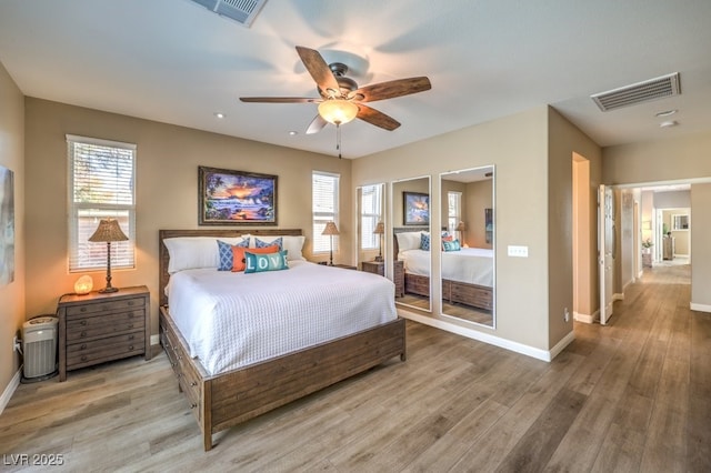 bedroom featuring hardwood / wood-style floors and ceiling fan