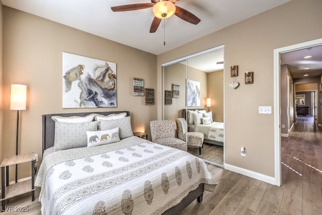 bedroom featuring wood-type flooring, a closet, and ceiling fan