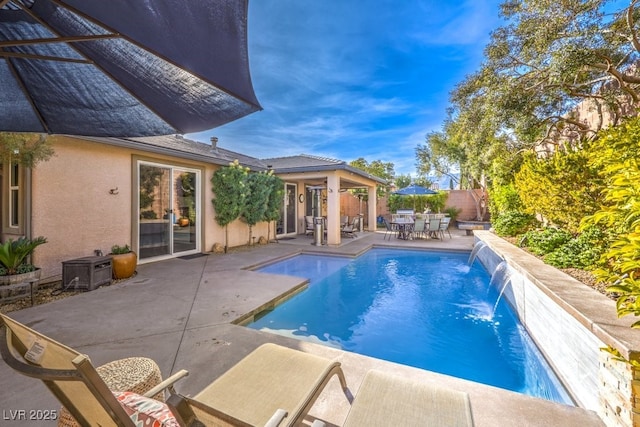 view of swimming pool featuring a patio and pool water feature