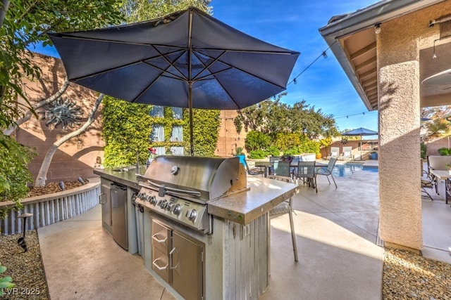 view of patio / terrace with a grill and area for grilling