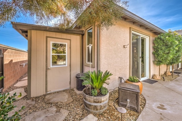 entrance to property featuring a patio