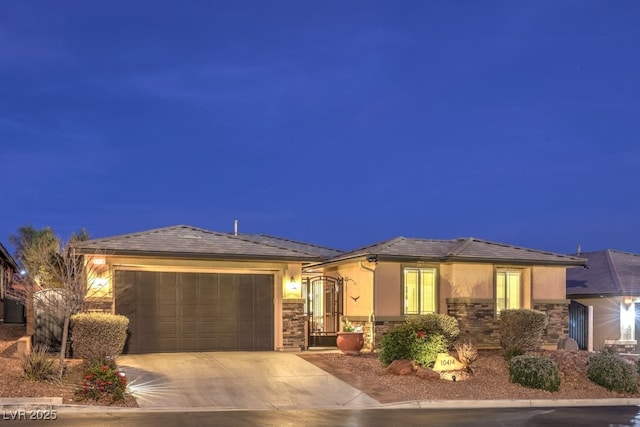 view of front of property with central AC and a garage