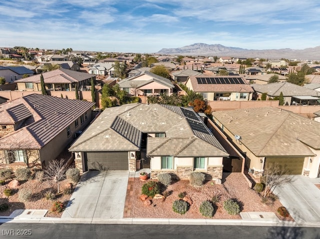 birds eye view of property with a mountain view