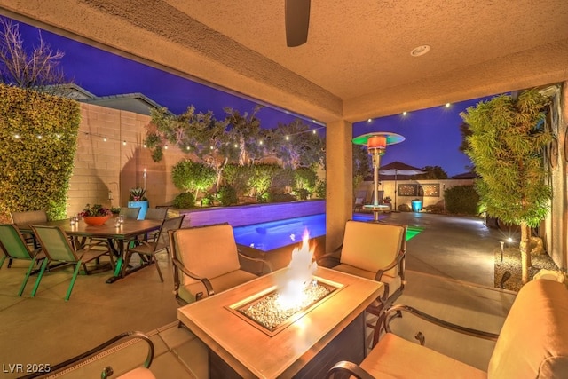 view of patio with an outdoor fire pit