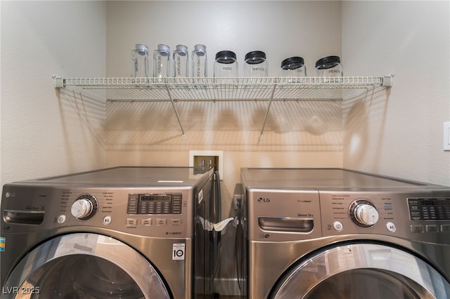 washroom with washer and dryer