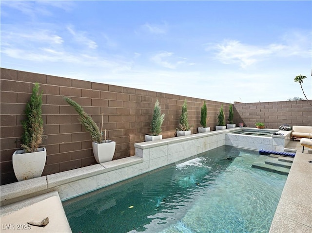 view of swimming pool with an in ground hot tub and pool water feature