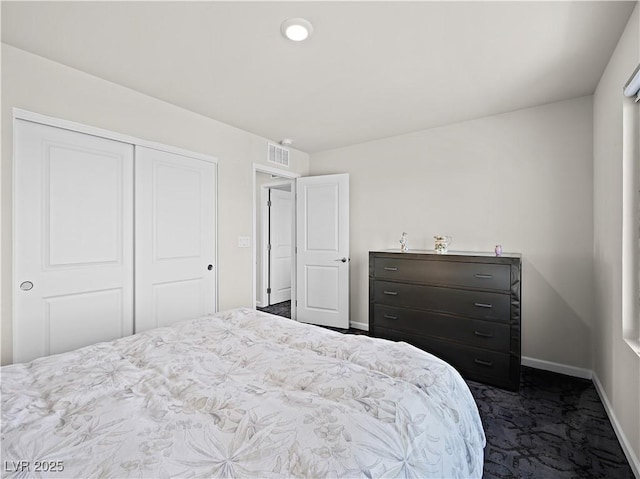 carpeted bedroom featuring a closet