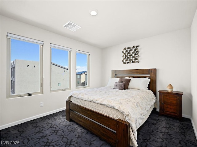 bedroom featuring dark colored carpet