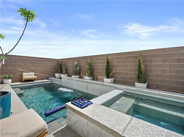 view of swimming pool with pool water feature and an in ground hot tub