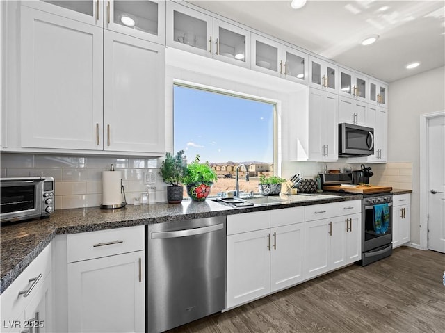 kitchen with white cabinetry, sink, and stainless steel appliances