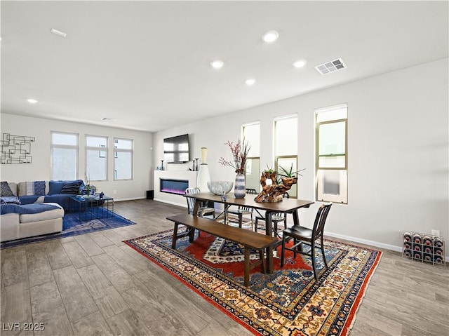 dining room with wood-type flooring