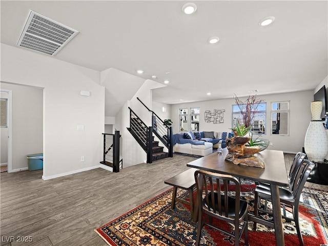 dining space featuring wood-type flooring