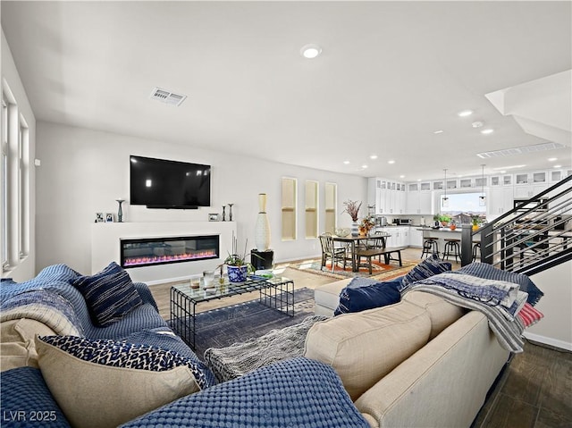 living room featuring dark hardwood / wood-style flooring