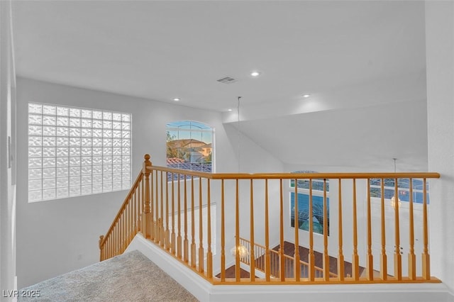 hallway with vaulted ceiling