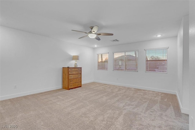 unfurnished bedroom with ceiling fan and light carpet