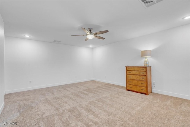 carpeted empty room featuring ceiling fan