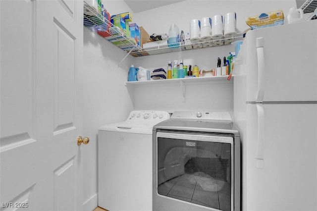 washroom featuring washing machine and dryer