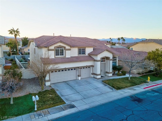 view of front of property featuring a mountain view and a garage