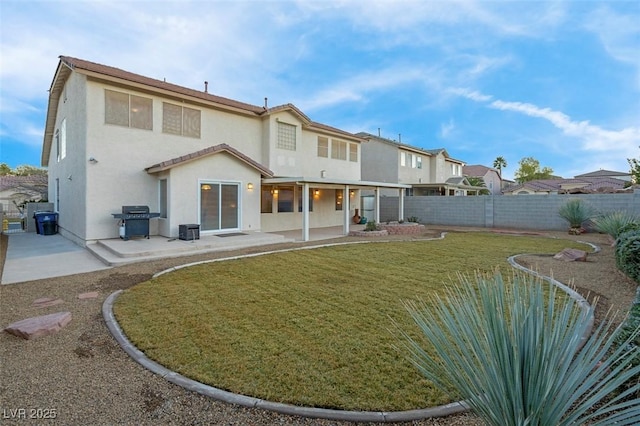 rear view of property with a lawn, a patio, and central air condition unit