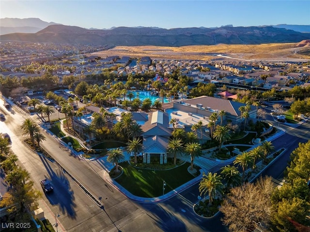 aerial perspective of suburban area featuring a mountain backdrop