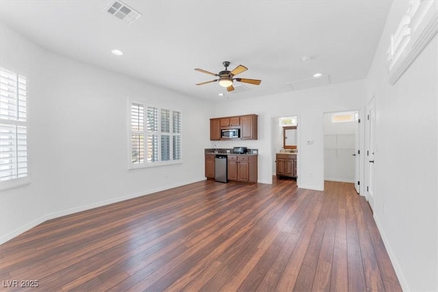 unfurnished living room featuring dark hardwood / wood-style floors and ceiling fan