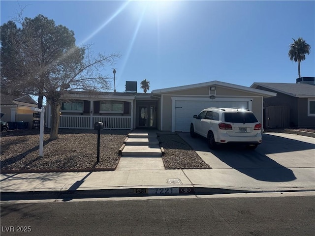 single story home with a garage