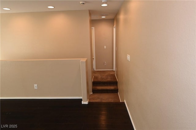 hall with dark hardwood / wood-style floors