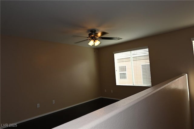 interior space featuring ceiling fan