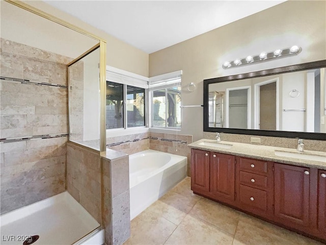 bathroom featuring vanity, tile patterned floors, and separate shower and tub