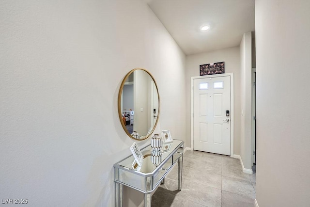 doorway with light tile patterned floors