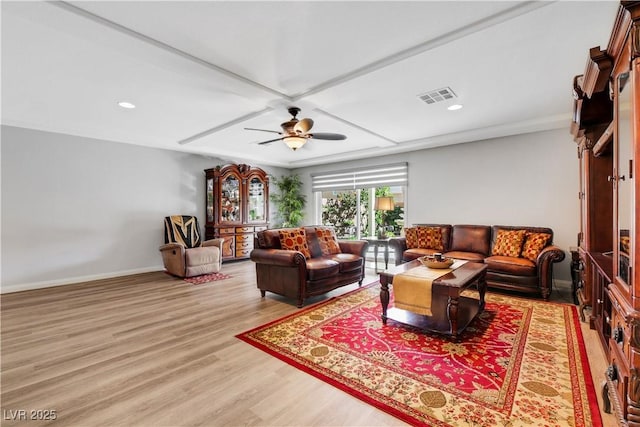 living room featuring light hardwood / wood-style flooring and ceiling fan