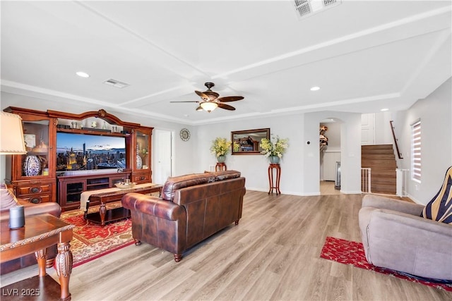 living room with ceiling fan and light wood-type flooring