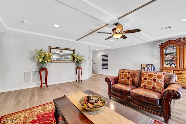 living room with ceiling fan and light hardwood / wood-style flooring