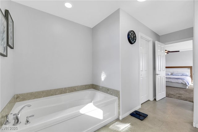 bathroom featuring a washtub and tile patterned floors