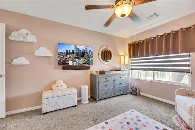 bedroom featuring light carpet and ceiling fan