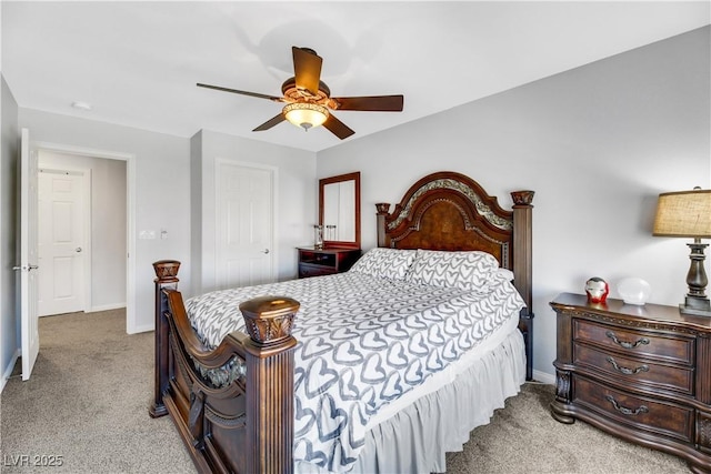 bedroom with ceiling fan and light carpet