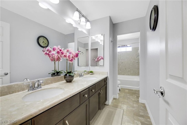 full bathroom with vanity, bathing tub / shower combination, and toilet