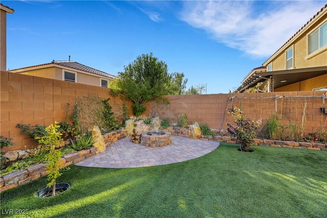 view of yard featuring a patio area and an outdoor fire pit