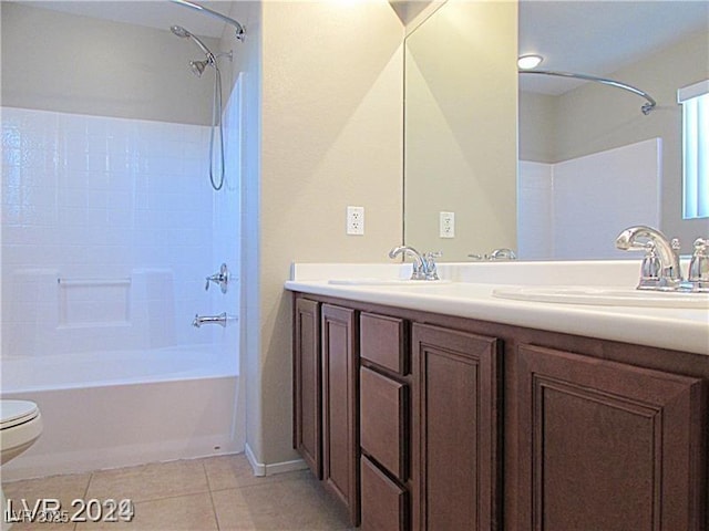 full bathroom with shower / bath combination, vanity, tile patterned floors, and toilet