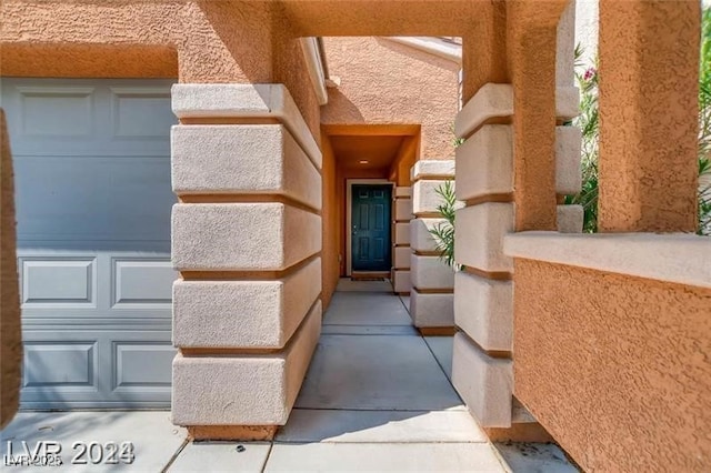 entrance to property featuring a garage