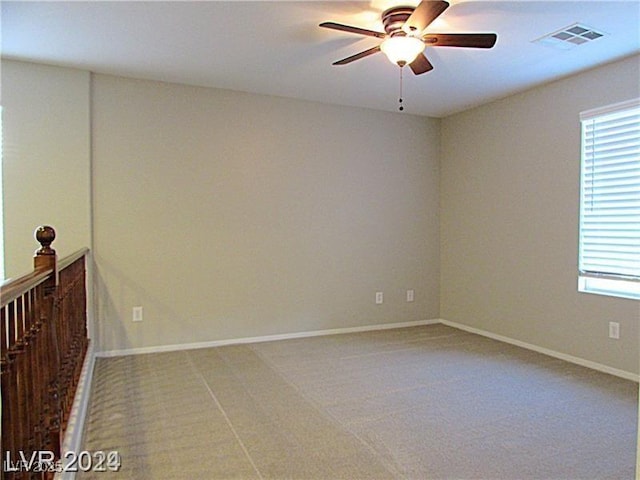 carpeted empty room with ceiling fan