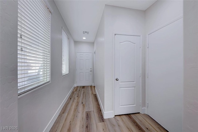 corridor featuring light hardwood / wood-style flooring