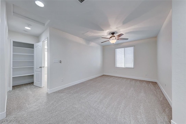 empty room with light carpet and ceiling fan