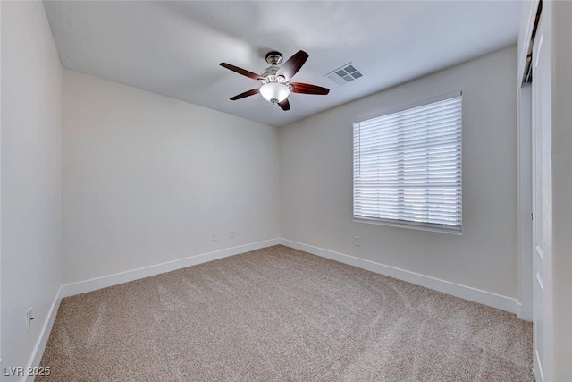 carpeted empty room with ceiling fan