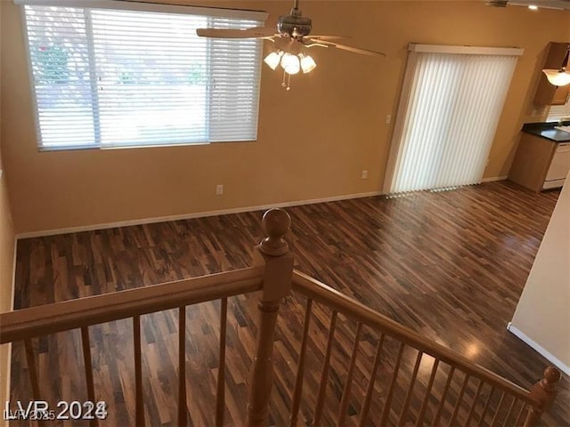 unfurnished room with wood-type flooring and ceiling fan